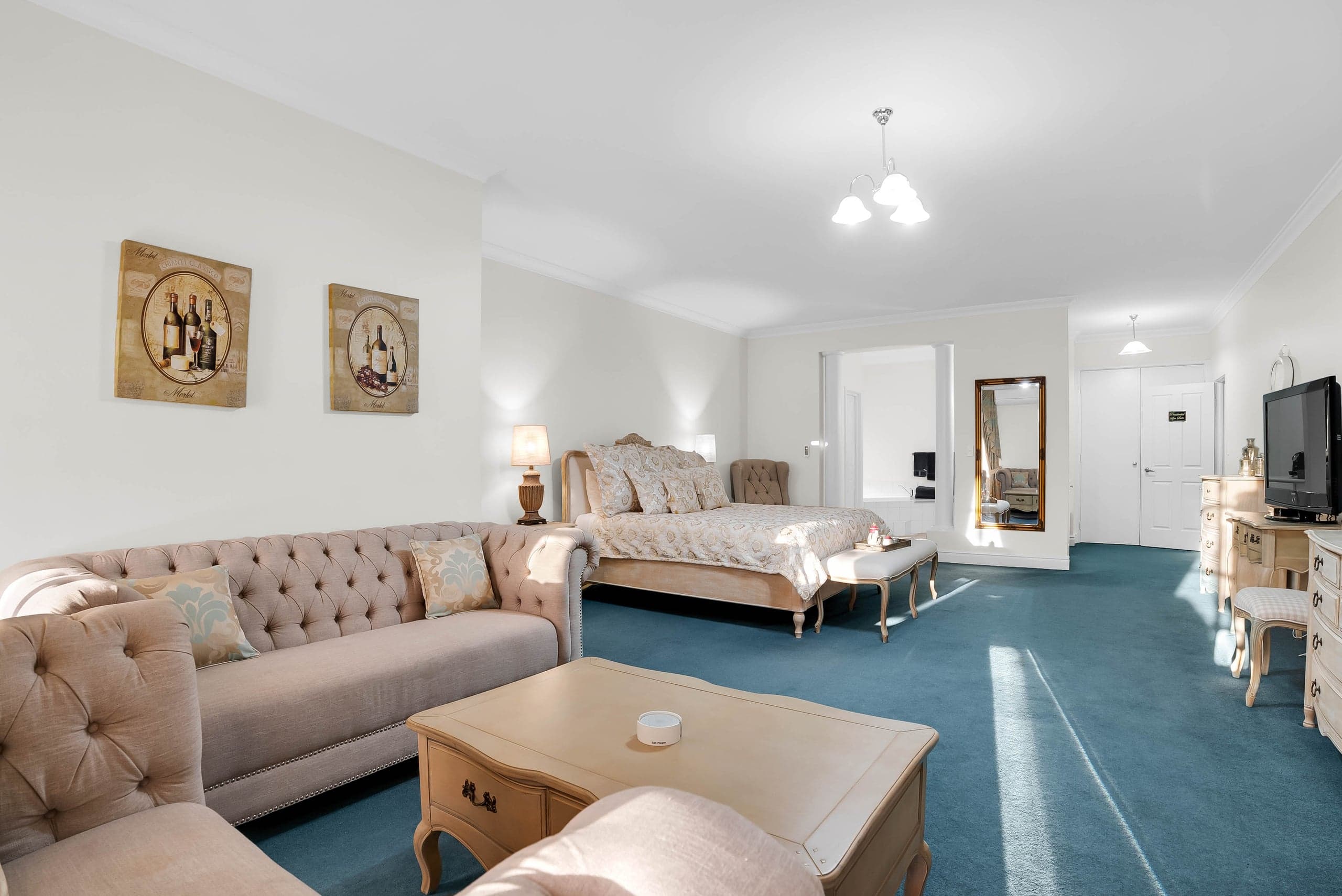Spacious guest suite lounge area with twin sofas