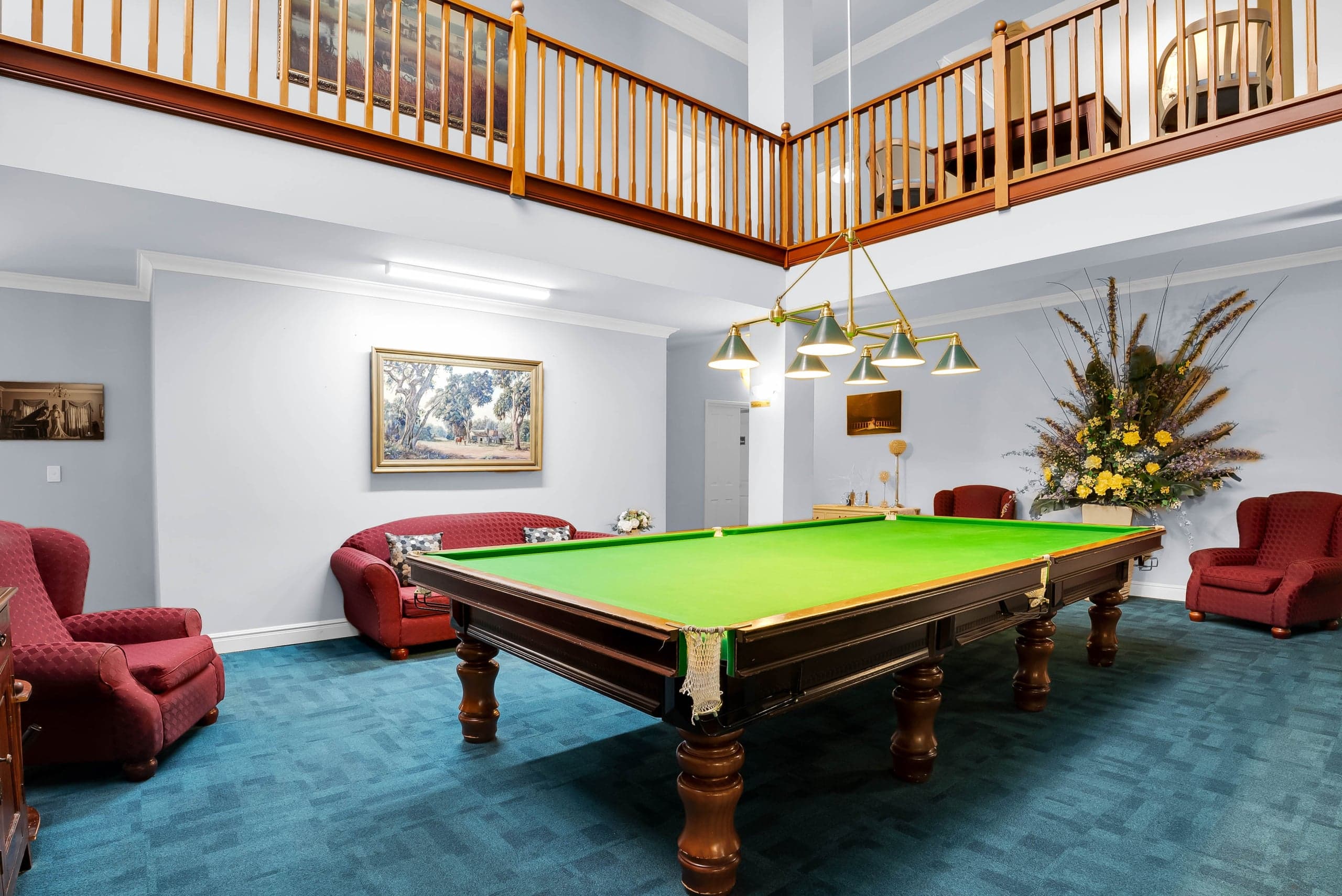 Billiards room with full-size table and mezzanine
