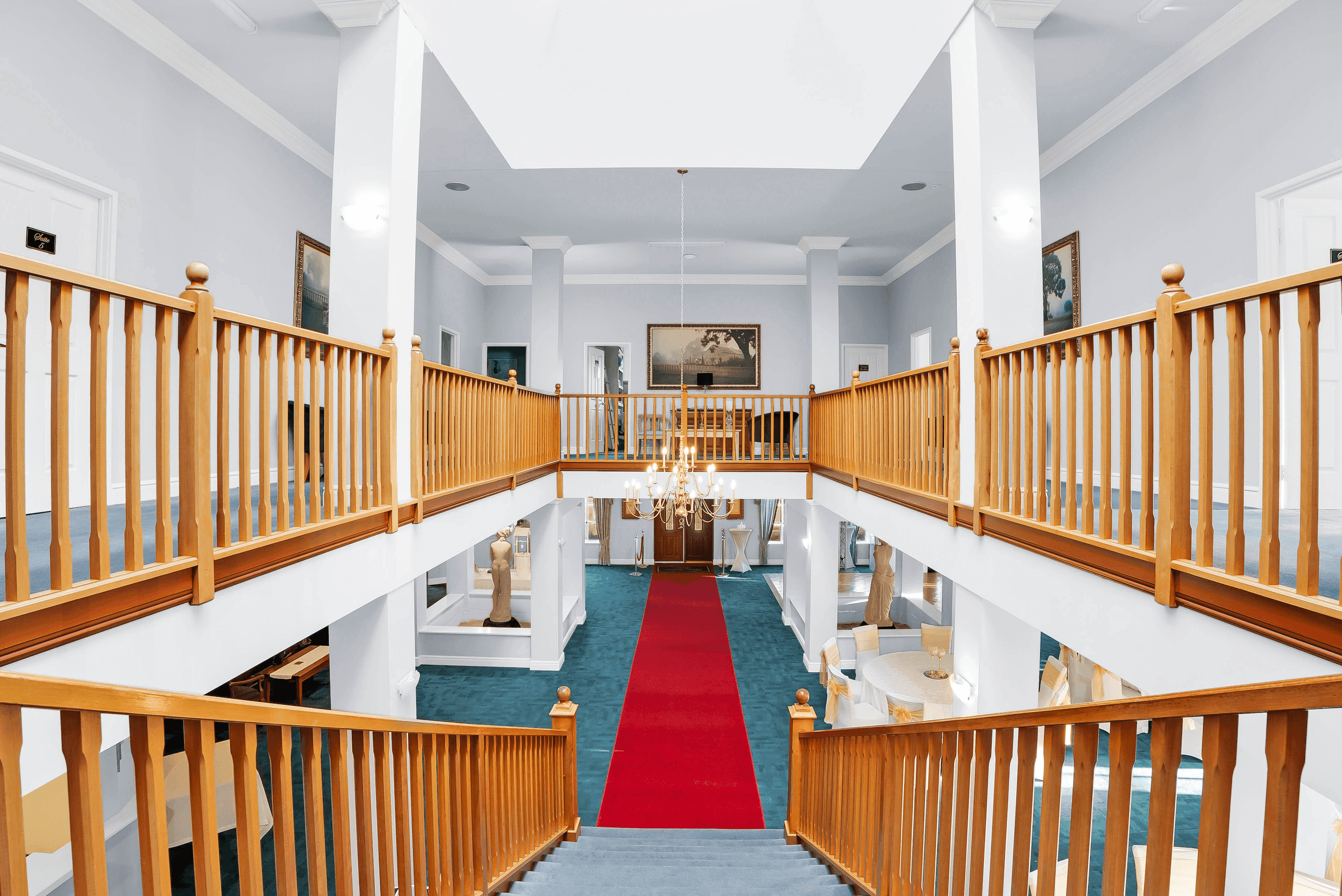 Double staircase and mezzanine landing inside Peel Manor House